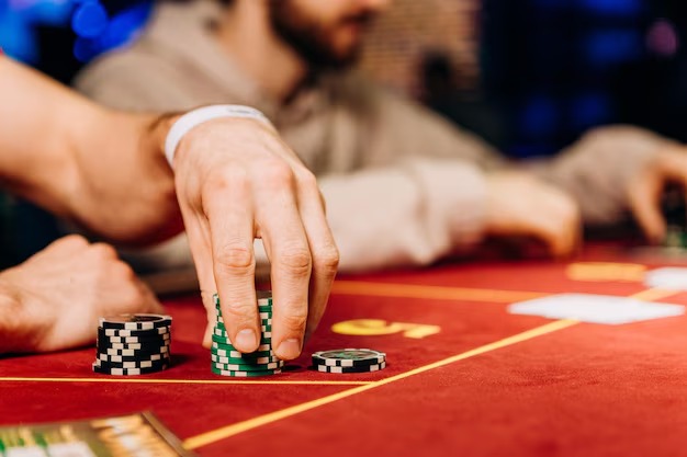 Live blackjack table on mobile phone screen showing dealer and player cards